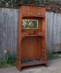 English Arts and Crafts cabinet with hand-hammered copper strap hinges, possibly Liberty.  Umbrella, coat rack, hat rack